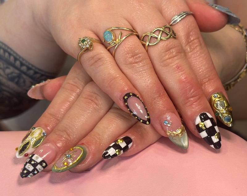 Nails with various colors textures and 3D elements.