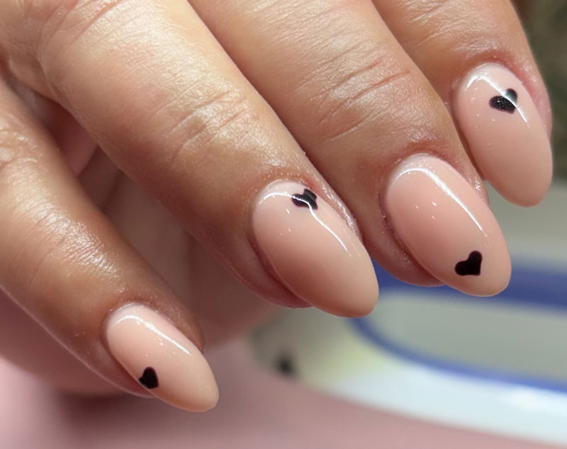 Nails with hearts painted on them